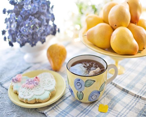 A cup of tea with light snacks
