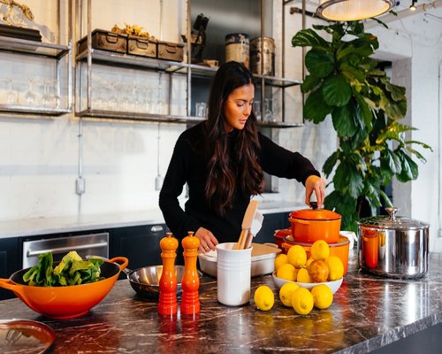 Person preparing a meal in the kitchen